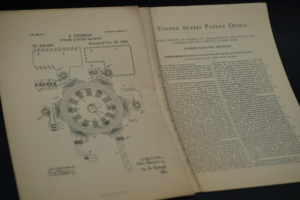 Original 1895 patent drawing and specification of Elihu Thomson’s Dynamo-Electric Machine, U.S. Patent 548,406, photographed for Mitmannsgruber historical collection.